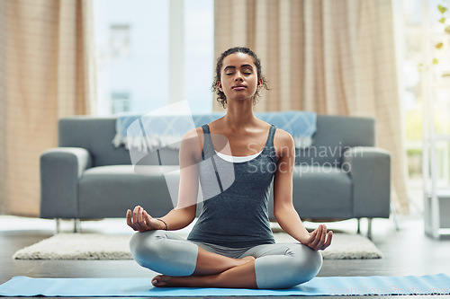 Image of Training, yoga and woman with meditation, home and focus for wellness, fitness and healthy lifestyle. Female person, yogi and girl on the floor, living room and exercise for balance, chakra and zen