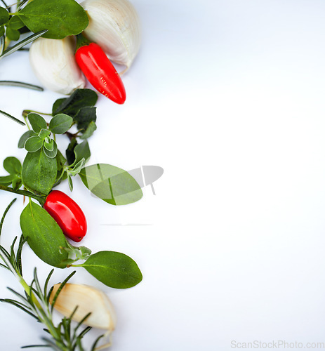 Image of Cooking, spices and ingredients with food and mockup in studio with green herbs and vegetables. Healthy diet, nutrition and white background with vegan and garlic and template space for recipe