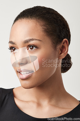 Image of Happy woman, face and makeup in natural beauty, cosmetics or skincare against a white studio background. Isolated young and attractive female person or model looking away with facial treatment