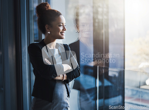 Image of Business woman, window and smile for vision, goals and future of career with ideas, mission or mindset. Young businesswoman, focus and thinking in workplace with memory, reflection or corporate dream