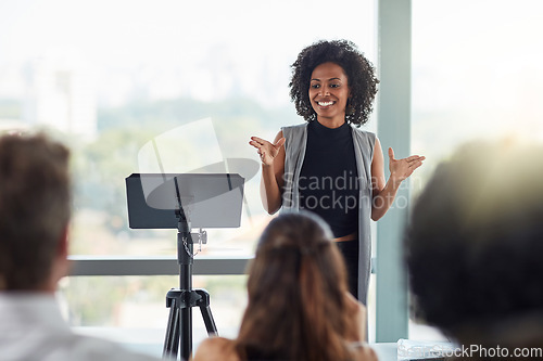 Image of Corporate, businesswoman with presentation and in business meeting in conference room at work. Presenter, happy female speaker and black woman at seminar or workshop speaking with businesspeople