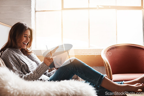 Image of Smile, tablet and credit card with an ecommerce woman on a sofa in the living room of her home. Online shopping, finance and fintech banking with a happy young female online customer in her house