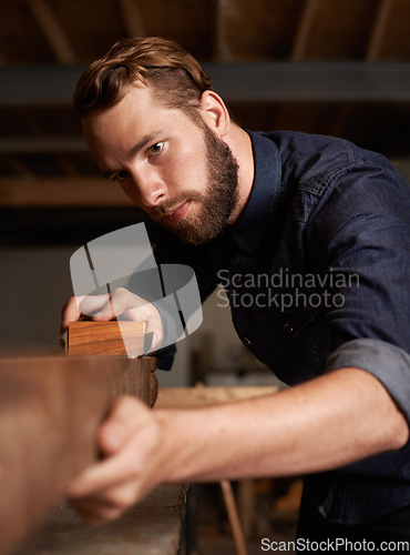 Image of Carpenter, wood sanding and man working on building construction and architecture project. Home improvement, maintenance and handyman work of a young male employee with carpentry tool for woodwork