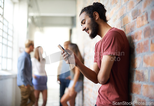 Image of School, phone and relax with man in hallway for social media, technology or internet. Eduction, learning and scholarship with male student on university campus for connection, contact or text message