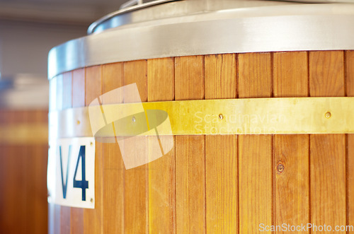 Image of Brewery, keg and barrel for beer, alcohol and brewing process in warehouse. Wooden, drum and alcoholic beverage at a distillery for storage, fermentation and manufacturing, industry or tank system