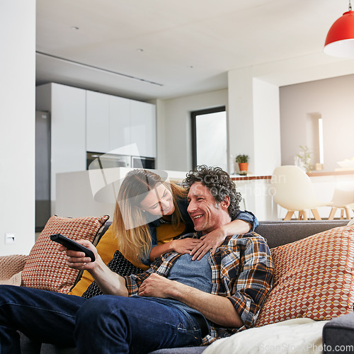 Image of Happy couple, tv and hug to watch movies, news and cable show for media entertainment on lounge sofa. Mature man, woman and relax with television remote, subscription and smile for streaming service