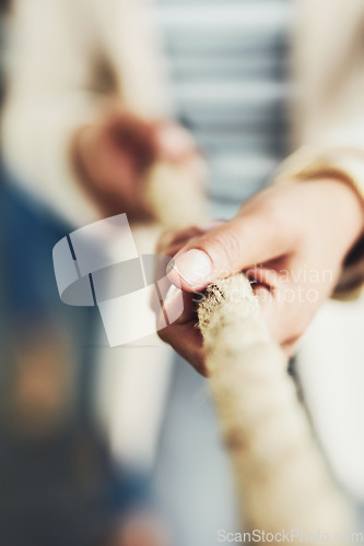 Image of Closeup of hand, rope and tug of war for team building, business people and collaboration with competition. Corporate conflict resolution, challenge and teamwork with employees in workplace