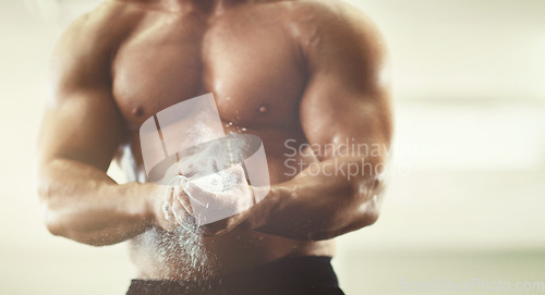 Image of Hands, fitness and powder dust in gym for grip, workout and exercise for wellness. Sports, health and man, bodybuilder or male athlete clapping with chalk and ready to start training for muscles.