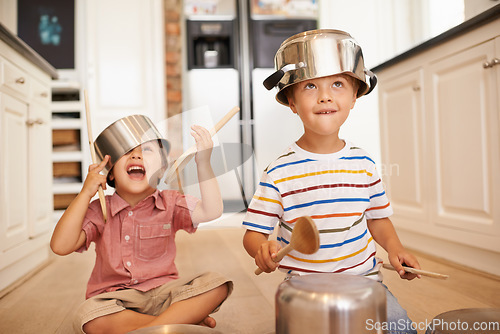 Image of Smile, pots and playing with children in kitchen for imagination, fantasy and games. Bonding, siblings and happy with kids and kitchenware on floor of family home for music, noise and happiness