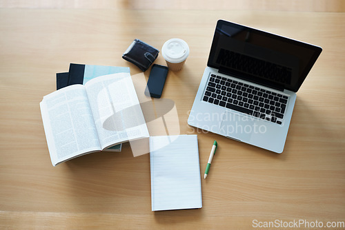 Image of Top view, notebooks and laptop with study equipment, resources and smartphone with connection. Book, computer and cellphone with coffee, wallet and planning with software, website and online tool