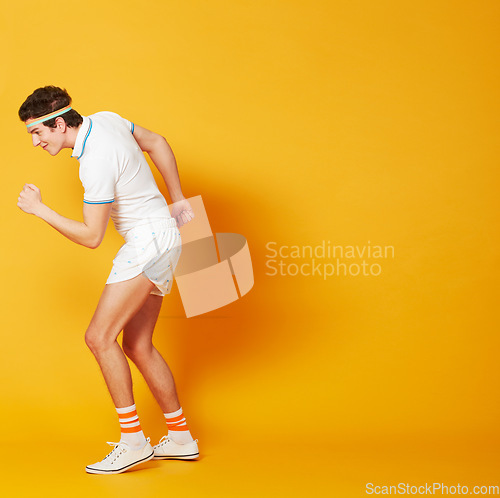 Image of Fist, exercise and sports man isolated on yellow background in power workout, training and retro athlete mockup. Moving, walking and celebration of tennis player or person, fitness energy and studio