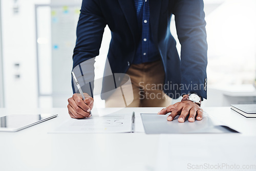 Image of Workplace, professional and writing man with paperwork at a desk with a tablet for website on app. Entrepreneur, businessman and working on documents with expert for analysis and planning in company.