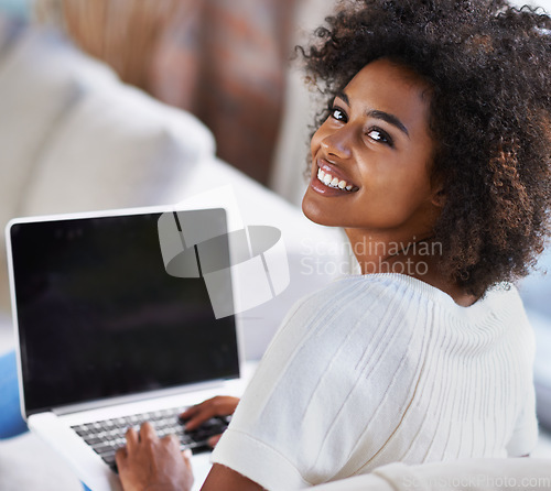 Image of Portrait, laptop and remote work with a business black woman in her home as a freelance entrepreneur. Computer, technology and self employed with a young female person working in the living room