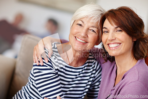 Image of Woman, grandmother and hug portrait in home with family, care and parent love or smile. Happiness on face, retirement and adult with elderly mom, embrace together on couch and living room