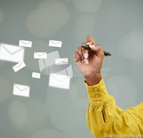 Image of Woman, hands and writing with email icons for communication, advertising or marketing on mockup. Hand of female person holding pen with envelopes for planning, networking or online notes on space