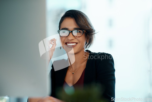 Image of Business woman, happy and computer in glasses reflection for reading, online review and editor analysis or news. Smile of biracial person or professional worker with website or results on desktop pc