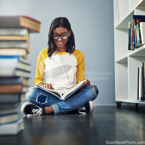 Image of Library book, student and woman reading history info, research or books for back to school education, university or college. Learning academy, scholarship study and female person sitting on floor