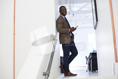 Image of Portrait, happy man and typing on cellphone in office for online contact, mobile technology or mockup. Black male worker, business and texting on smartphone, networking app or connect to social media