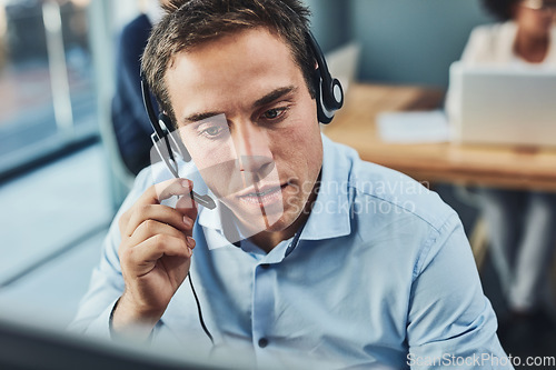 Image of Businessman, call center and consulting with headphones in customer support, service or telemarketing at office. Man employee consultant or agent talking on PC for online advice or help in contact us