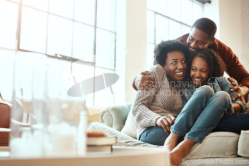 Image of Love, bond and family hugging while relaxing together in the living room of their modern house. Happy, smile and African parents spending quality time, talking and hugging girl child on sofa at home.