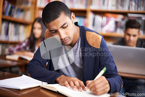 Image of Study, writing and college with man in library for education, research and classroom quiz. Focus, learning and notebook with male student on university campus for knowledge, scholarship and project