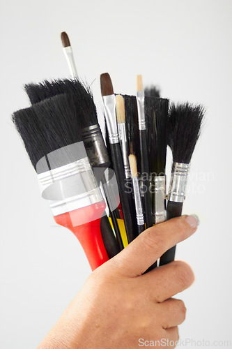 Image of Paint brush, hand closeup and creativity tool for art or contractor work in a home. Creative start, painter and person or artist tools for house renovation, canvas construction and decor equipment