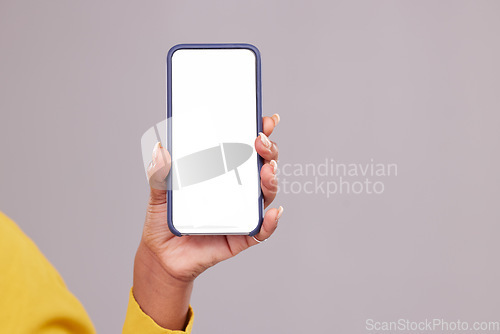 Image of Phone screen, mockup and hand of woman isolated on studio background for mobile app or advertising space. Closeup of person or online user cellphone with mock up for website, contact or ux design