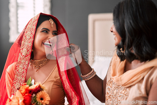 Image of Happy, bride and bridesmaid getting ready for a wedding, laughing and helping in a room. Support, love and a young woman in traditional Indian clothes for marriage ceremony with a friend or sister