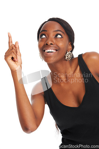 Image of Happy, advertising and pointing with a black woman in studio isolated on a white background for information. Smile, marketing and hands gesture with a young female brand ambassador showing space