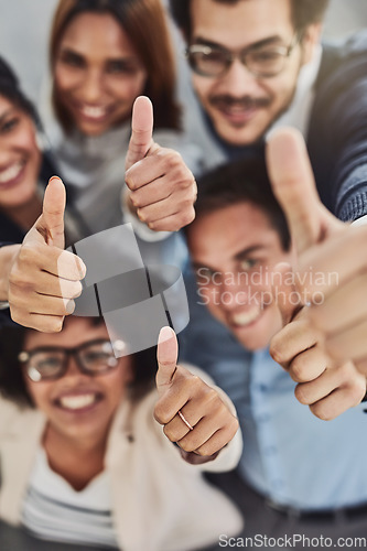 Image of Business people, hands and thumbs up above for winning, success or teamwork at the office. Top view of employee group showing hand or thumb emoji, yes sign or like in team win, victory or good job