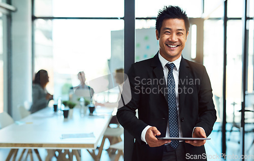 Image of Portrait, office and asian businessman with tablet in office or standing with confidence, pride and happiness in corporate workplace. Man, manager or professional worker or employee with technology