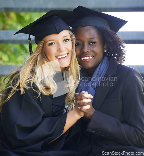 Image of Portrait, graduation and women university friends holding hands on campus together as graduate students. Happy, smile and education with a female college student and her friend celebrating graduating