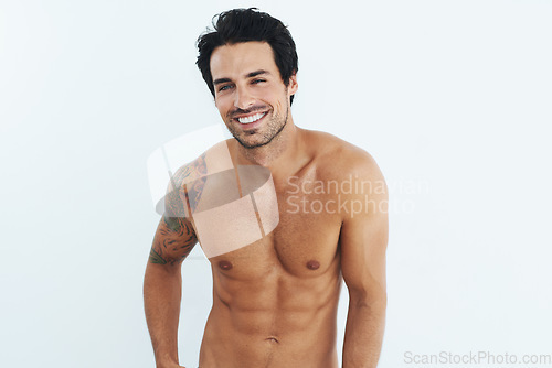 Image of Portrait, fitness and man with body, muscle and abdomen against a white studio background. Male person, happy model and guy with abs, mockup and shirtless with workout goal, happiness and wellness