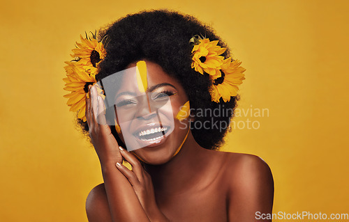 Image of Portrait, smile and black woman with sunflowers in her hair, makeup and confident girl against a studio background. Face, female person and model with cosmetics, funny and natural care with happiness