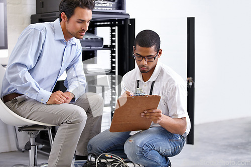 Image of Server, men and staff with a clipboard, talking and planning with cyber security, tech support and teamwork. Male employees, coworkers and programmers with IT, consultation and software update