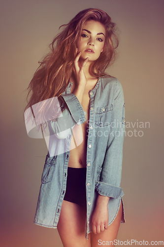 Image of Portrait, sexy woman and denim jacket in studio, fashion and style with underwear, sensual clothing and seductive. Female model, beauty and revealing clothes with confidence, empowerment and attitude