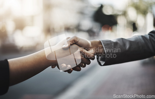 Image of Business people, handshake and meeting in city for partnership, introduction or greeting outdoors. Hand of employees shaking hands for b2b, collaboration or agreement in deal or hiring in urban town