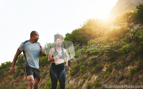 Image of Fitness, nature and couple walking by a mountain training for a race, marathon or competition. Sports, exercise and African athletes or runners doing outdoor running cardio workout together at sunset