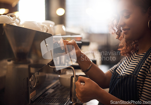 Image of Coffee machine, woman and barista steam milk in cafeteria for latte, espresso and drink appliance for catering. Waitress heating jug for hot beverage, caffeine process and restaurant service industry