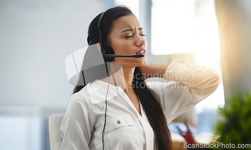 Image of Stress, burnout or woman in call center with back pain injury while working in telecom help desk office. Consultant, injured agent or tired sales girl with joint pain emergency, fatigue or accident