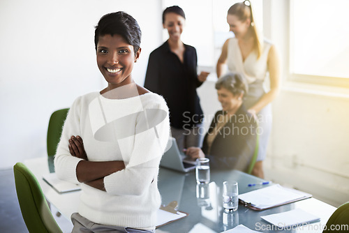 Image of Confidence, leader and portrait of a woman in a business meeting in a modern corporate office. Happy, success and professional Indian female manager standing with crossed arms in workplace boardroom