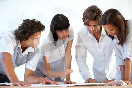 Image of Business people, architect and team with blueprint for construction planning, layout or ideas at office. Group of contractors looking at floor plan or building document for industrial architecture