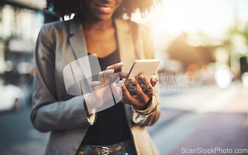 Image of Business woman, hands and phone in city for social media, communication or texting outdoors. Hand of female employee chatting online, email or mobile smartphone app or networking in urban town street