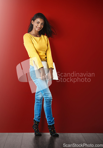 Image of Student girl, portrait and laptop by wall with smile for learning, connectivity or development mockup. Young woman, computer and happy for education, communication or social network by red background