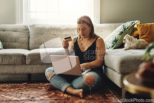 Image of Laptop, credit card and woman in home online shopping, ecommerce and fintech application, loan or finance on floor. Gen z person typing, banking or website on computer, digital payment or transaction