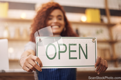 Image of Open sign, hands and woman in shop, store and advertising notice of retail shopping time, board or trading information. Closeup, small business owner and opening banner for welcome, start or services