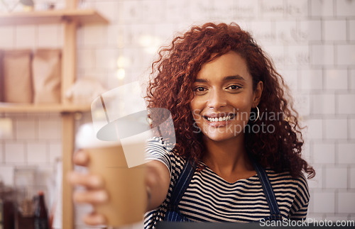 Image of Portrait, woman and smile of waitress with coffee cup in cafeteria, restaurant and small business store. Happy female barista, server and giving cappuccino, drinks order and friendly service in shop