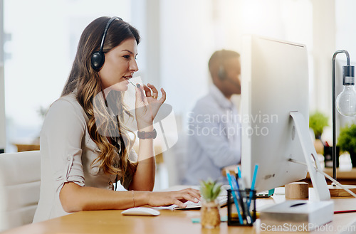 Image of Communication, mic or woman in call center consulting, speaking or talking at customer services. Virtual assistant, tech support or sales consultant in telemarketing or telecom company help desk