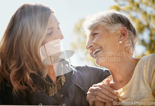 Image of Family, love or happy with a senior mother and daughter bonding outdoor together during a summer day. Smile, flare and retirement with a young man hugging her elderly parent outside in the park