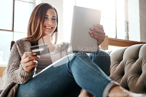Image of Happiness, tablet and credit card, woman on sofa in living room and internet banking or fintech in home. Technology, online shopping payment and girl on couch surfing retail website or digital shop.